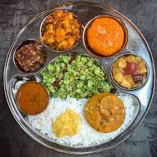 Veg Thali (Dine- In Only) 3 Curries (Dal Tadka or Veg Korma or Checkpea Masala or Eggplant Curry or Butter Paneer) + Plain Naan + Rice + Salad + Pickle + Raita